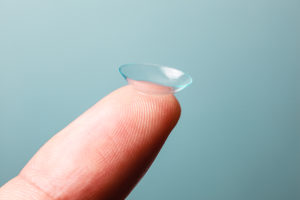 Contact lens balance on the tip of index finger VisualEyes based out of Ankeny Iowa, IA 50023